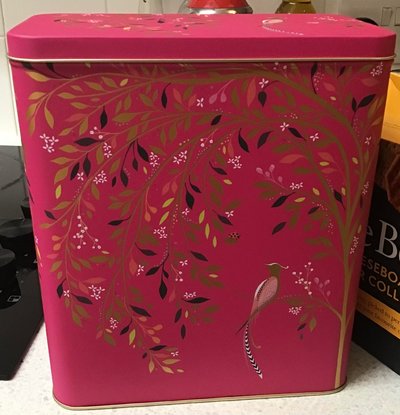 Pink Tin with Gold Details Birds and Hanging Leaves on Vines.jpg