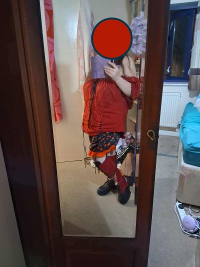 Me In My Awesome New Red And Black Temu Boots Face Obscured Side View.jpg