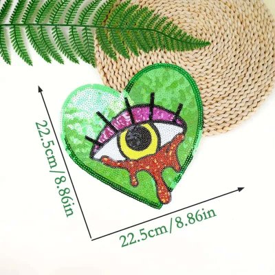 Temu Textiles 08 Image 02 - Pastel Pink Yellow Blue Crying Eye in Heart Sequins Large Applique.jpg